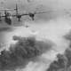 15th Air Force Liberators fly over the oil refineries at Ploiesti which were set on fire by previous waves of bombers. The ill-fated Operation Tidal Wave, which sought to destroy the facility, resulted in the loss of 53 aircraft and 660 air crewmen. (US Air Force)